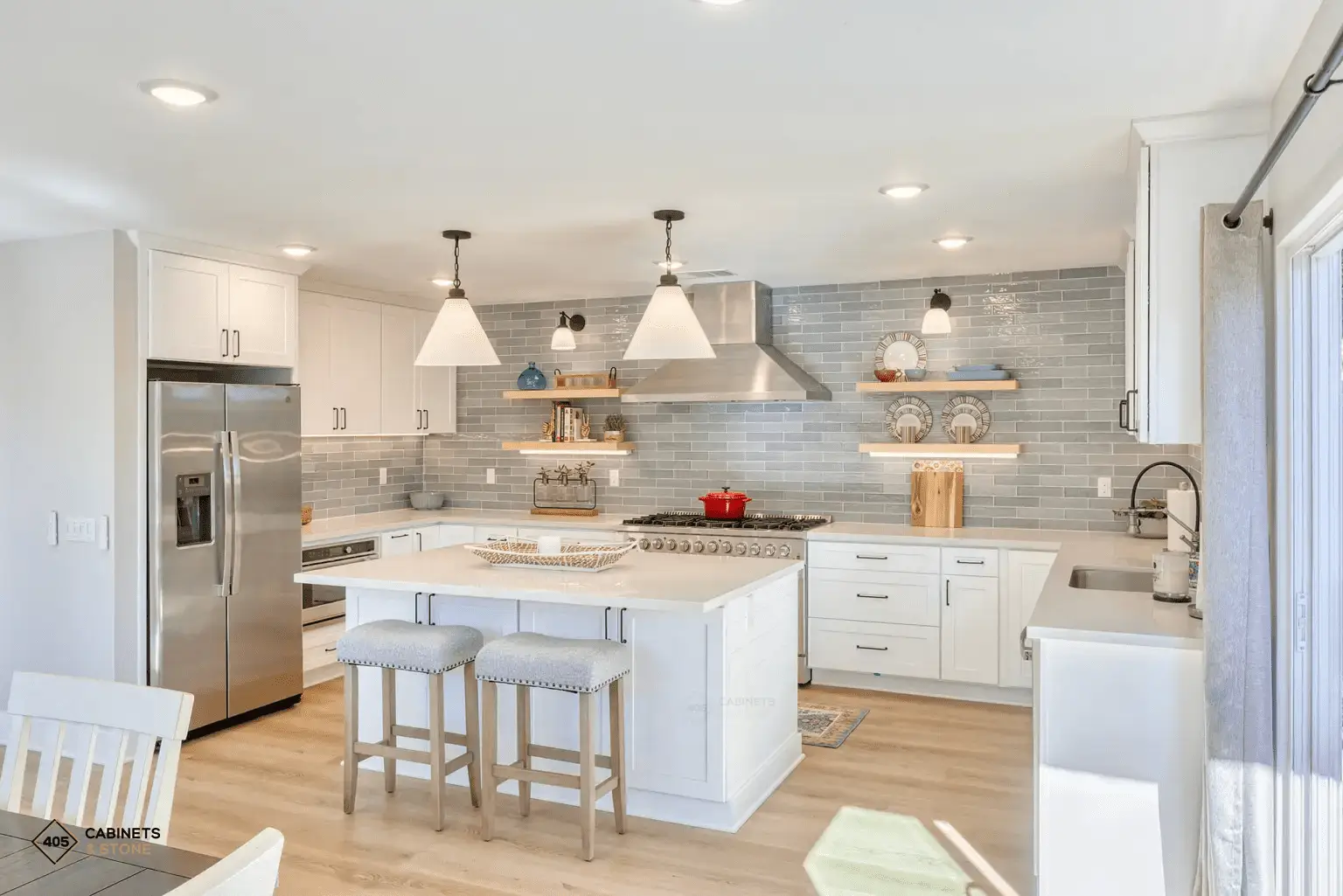 Remodeled kitchen with island, custom cabinetry, and tile backsplash